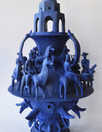 James Mortimer Sculpture Ceramic Blue architectural vase with figures riding animals